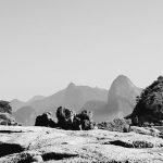 The landscape represents the immensity of nature and beauty, with the image of Christ in the background with his arms open to what remains of nature in Rio.